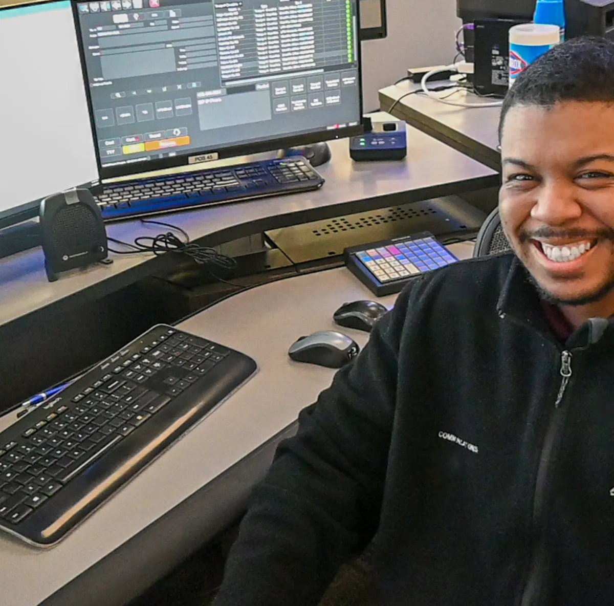 guy at desk smiling