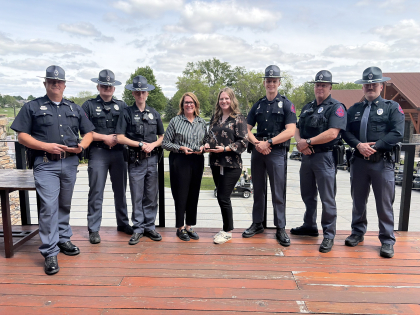 Several Nebraska State Troopers standing with awards from Mothers Against Drunk Driving