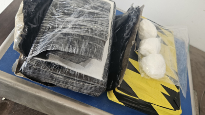 Wrapped packages containing 5.6 pounds of suspected cocaine