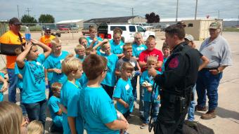 Officer meeting with a group of children